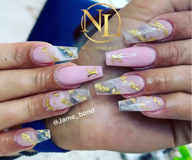Pink nails with clear tips and gold details